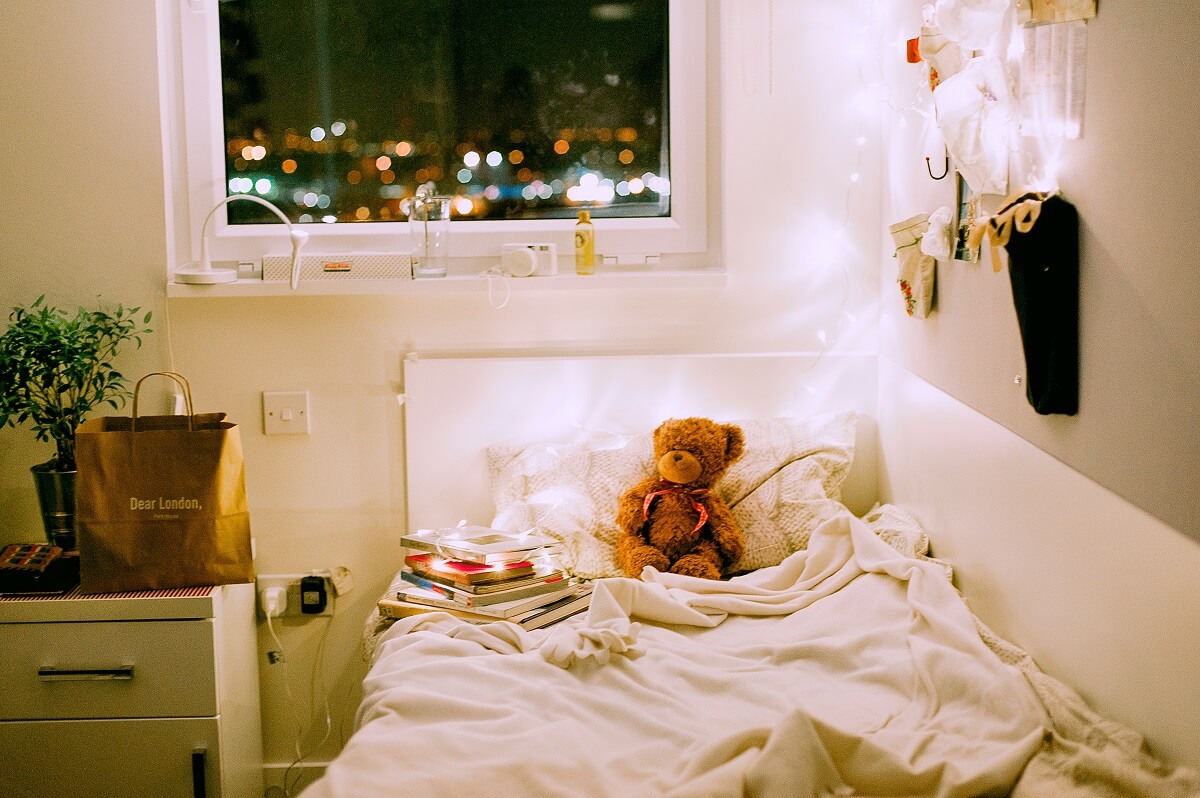 a bed in a corner of kids room