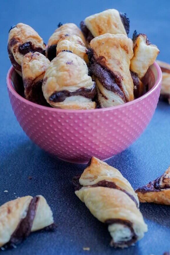 chocolate filled puff pastry placed inside a pink bowl
